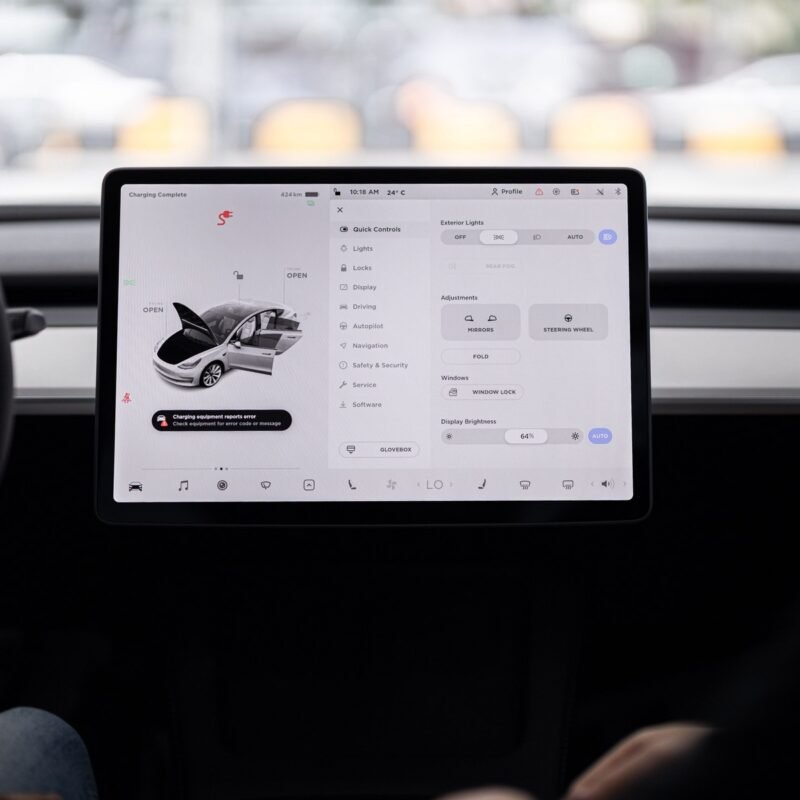 View of a modern car's dashboard featuring a digital display panel with control options.