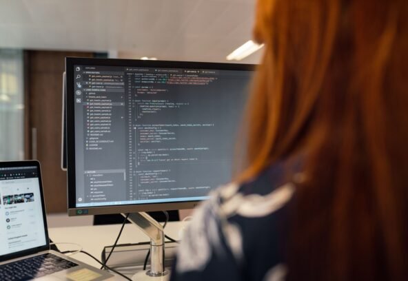pexels-3861951 A female engineer works on code in a contemporary office setting, showcasing software development.